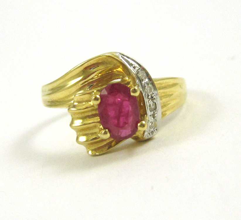 Appraisal: RUBY DIAMOND AND FOURTEEN KARAT GOLD RING set with four