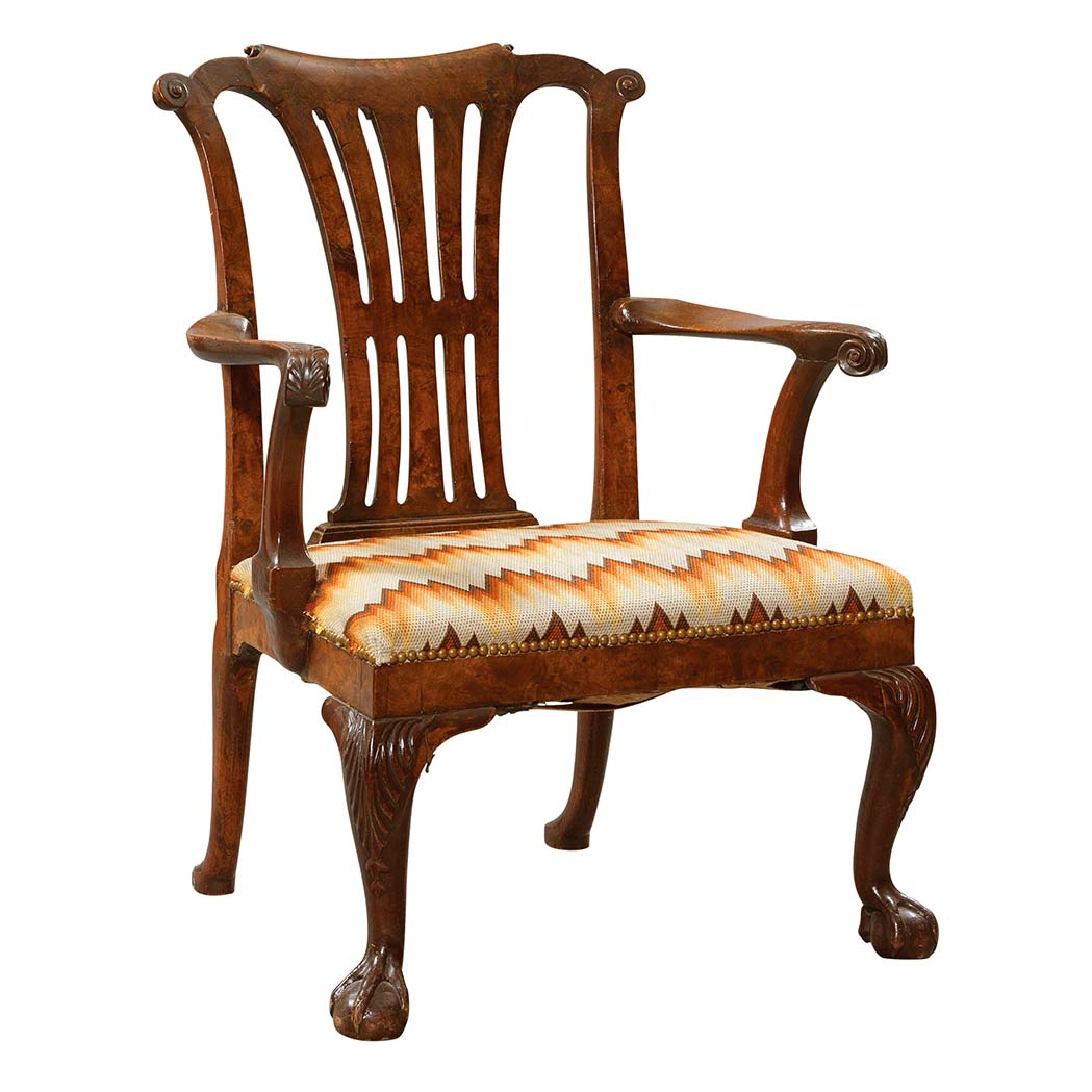 Appraisal: George II Walnut Armchair The pierced vasiform backrest above a