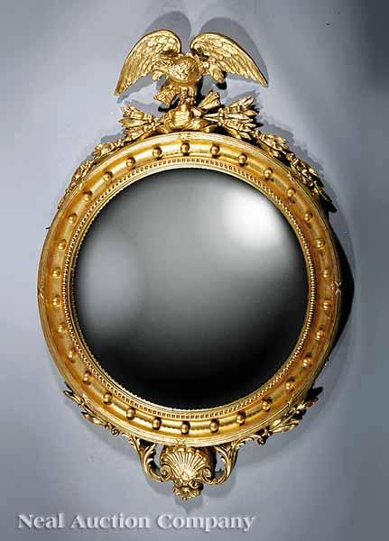 Appraisal: A Large Regency-Style Giltwood and Gesso Bullseye Mirror surmounted with