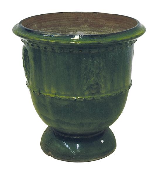 Appraisal: A GREEN GLAZED TERRACOTTA 'ANDUZE' URN flared cylindrical moulded with