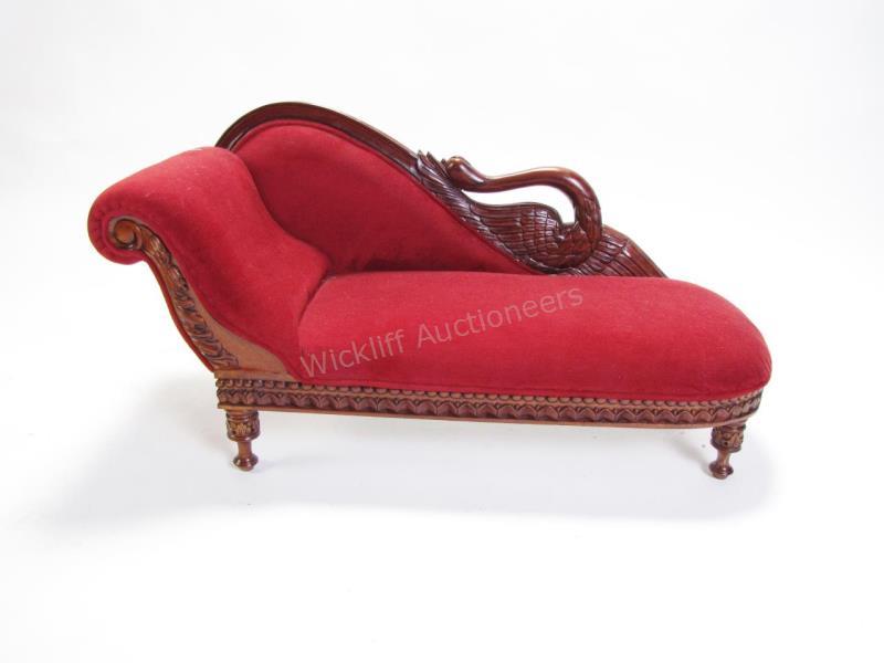 Appraisal: A doll size upholstered recamier with swan motif carved mahogany