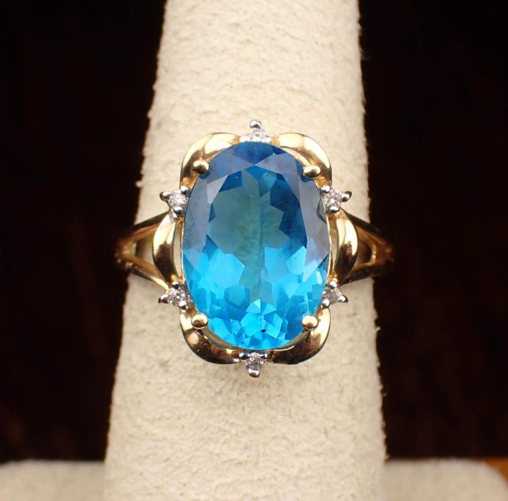 Appraisal: BLUE TOPAZ DIAMOND AND FOURTEEN KARAT GOLD RING The yellow