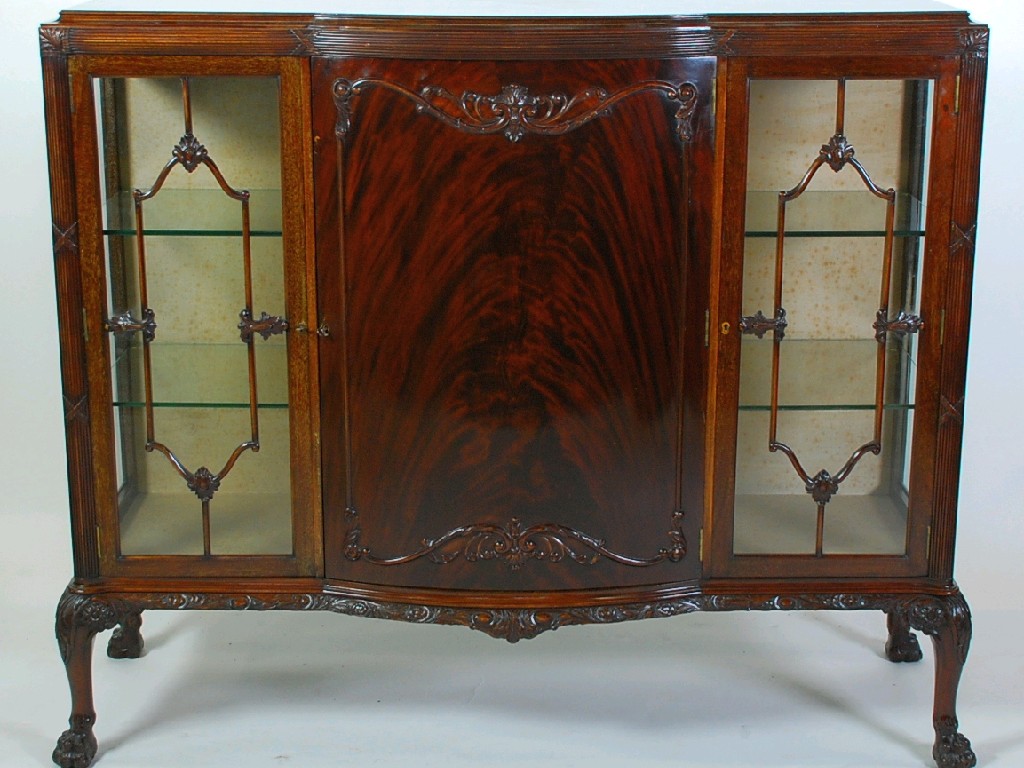 Appraisal: EARLY TWENTIETH CENTURY CARVED MAHOGANY SIDE BY SIDE DWARF DISPLAY