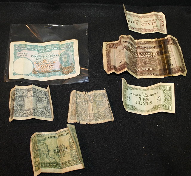 Appraisal: A SMALL COLLECTION OF BANK NOTES including a Malaya cent