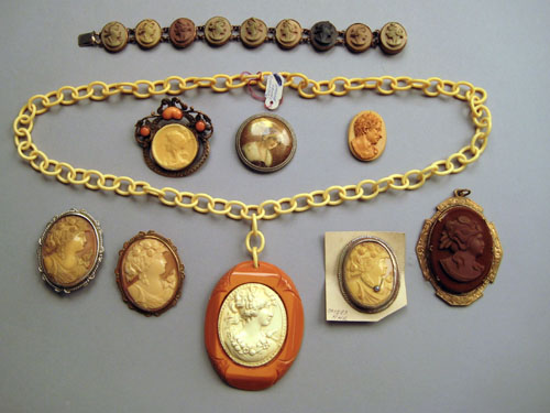 Appraisal: Celluloid cameo pendant and chain together with celluloid brooches and