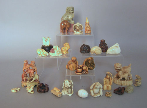 Appraisal: Group of twenty-two carved netsukes and four figures tallest -