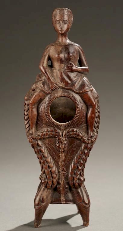 Appraisal: Female figure astride vessel A female figure astride a vessel