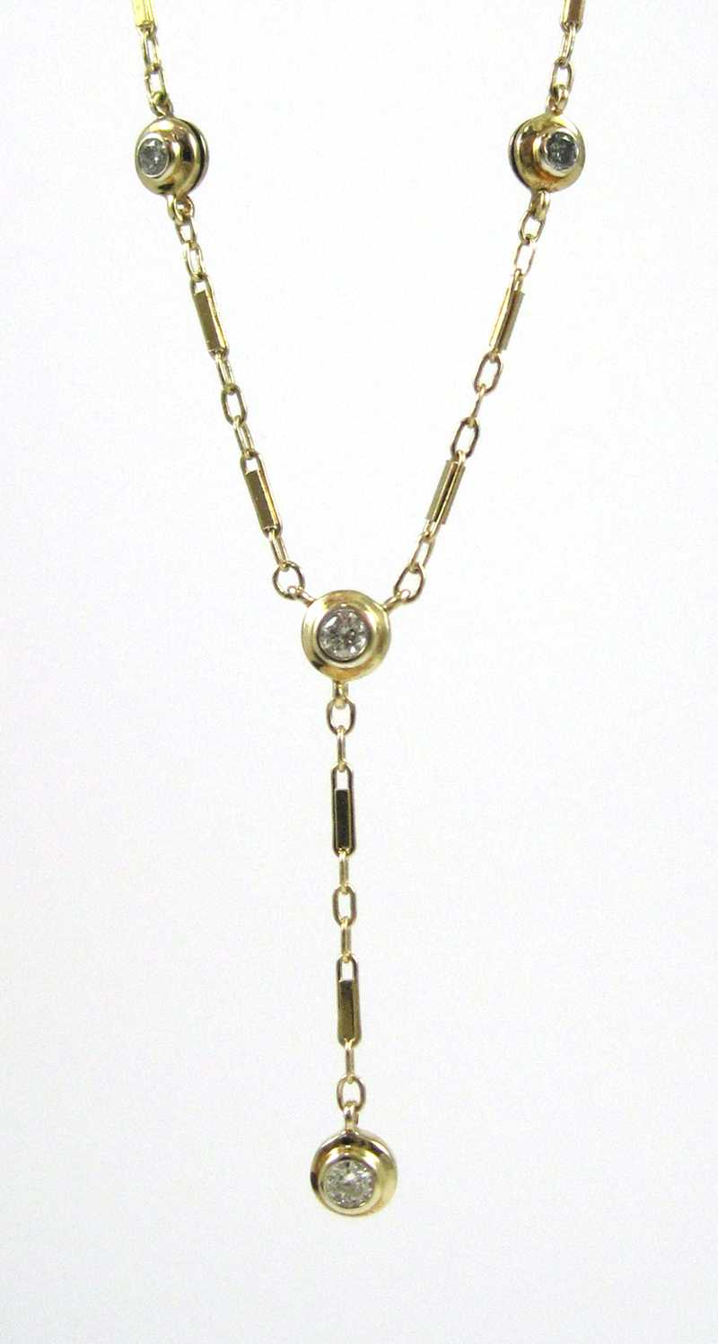 Appraisal: DIAMOND AND FOURTEEN KARAT GOLD NECKLACE measuring inches in length