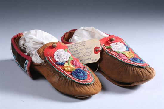 Appraisal: PAIR NATIVE AMERICAN WOODLANDS BEADED HIDE MOCCASINS Circa Partially beaded