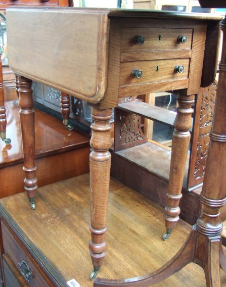 Appraisal: A th century mahogany drop-flap work table with a pair