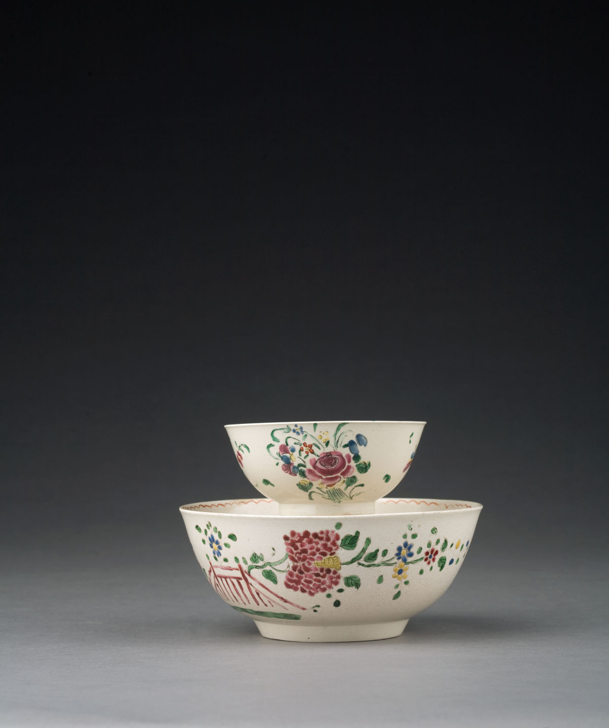 Appraisal: TWO STAFFORDSHIRE SALTGLAZE ENAMELED BOWLS CIRCA - The first painted