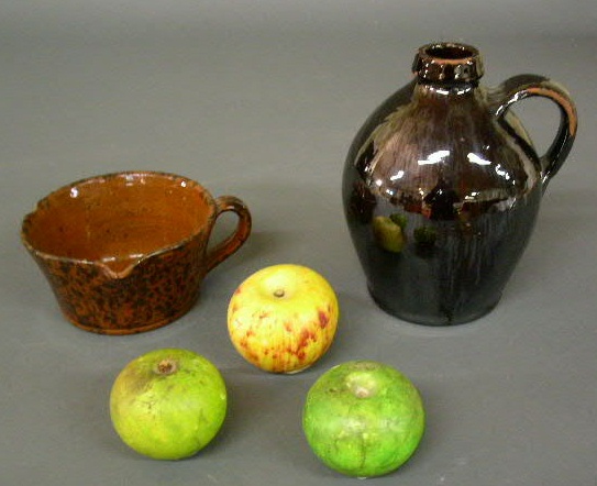 Appraisal: Redware jug cup h and three pieces of stone fruit