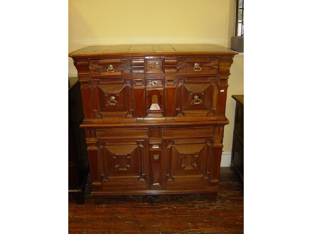 Appraisal: A th century fruit wood and oak sectional chest cupboard