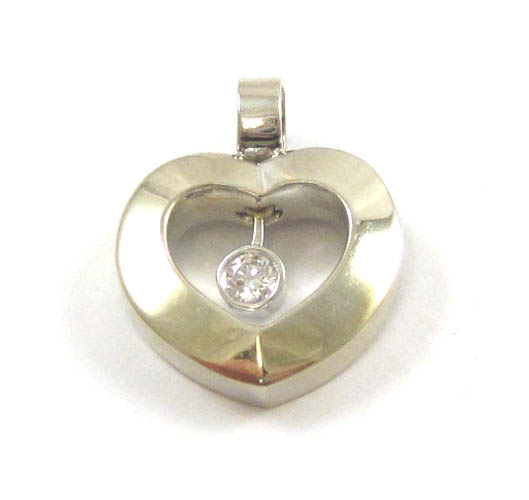 Appraisal: DIAMOND AND FOURTEEN KARAT WHITE GOLD PENDANT The open heart