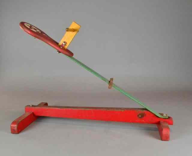 Appraisal: AN AMERICAN CHILD'S WOOD IRON TEETER-TOTTERA one sided teeter-totter painted