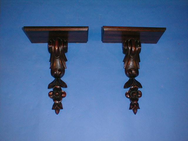 Appraisal: A pair of mahogany wall brackets each rectangular shelf supported