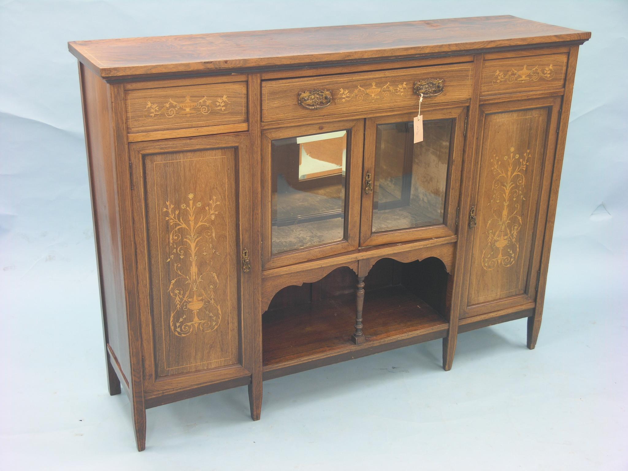 Appraisal: An Edwardian rosewood and marquetry chiffonier single drawer above bevelled