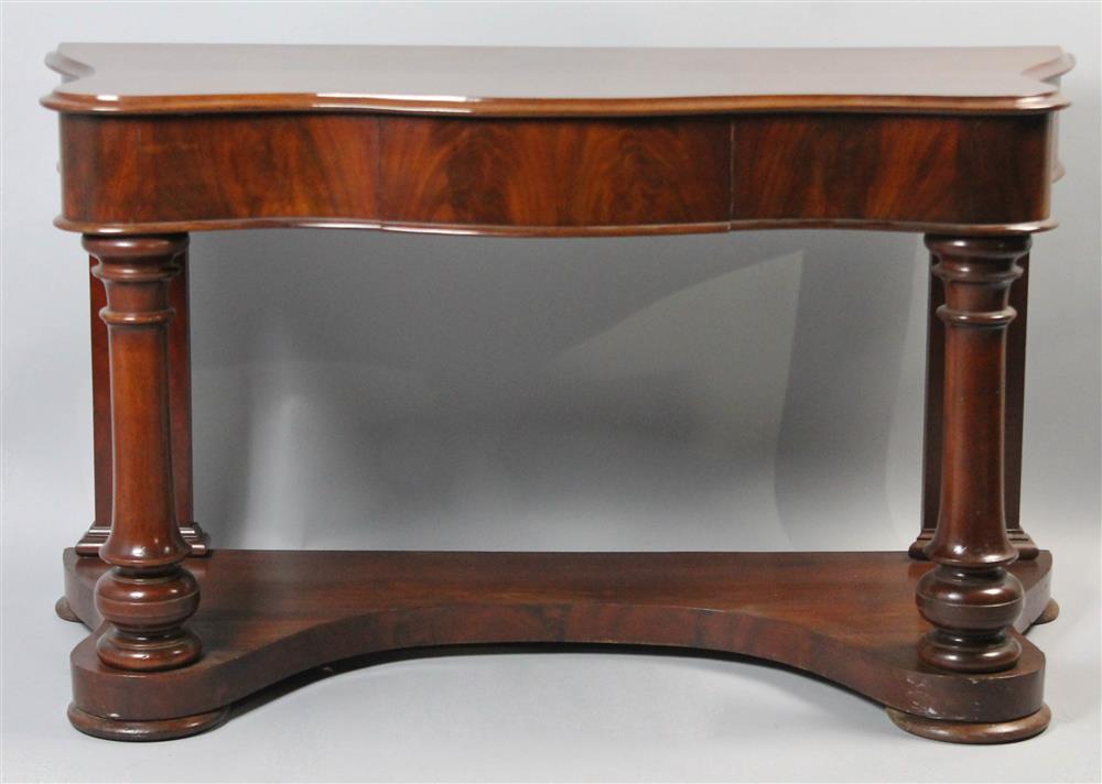 Appraisal: CLASSICAL MAHOGANY CONSOLE TABLE having a rectangular top with serpentine