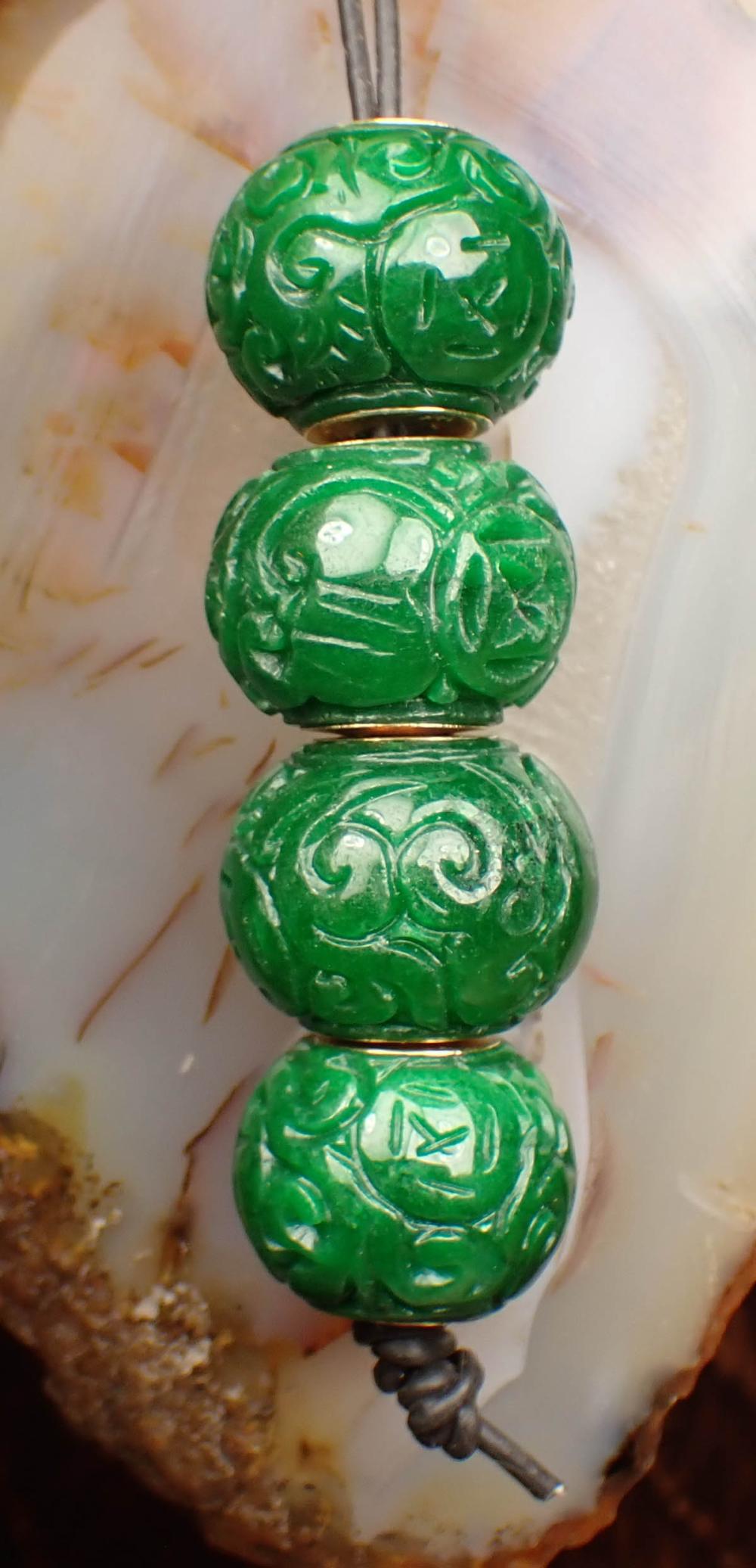 Appraisal: COLLECTION OF FOUR JADE AND FOURTEEN KARAT GOLD BEADS The