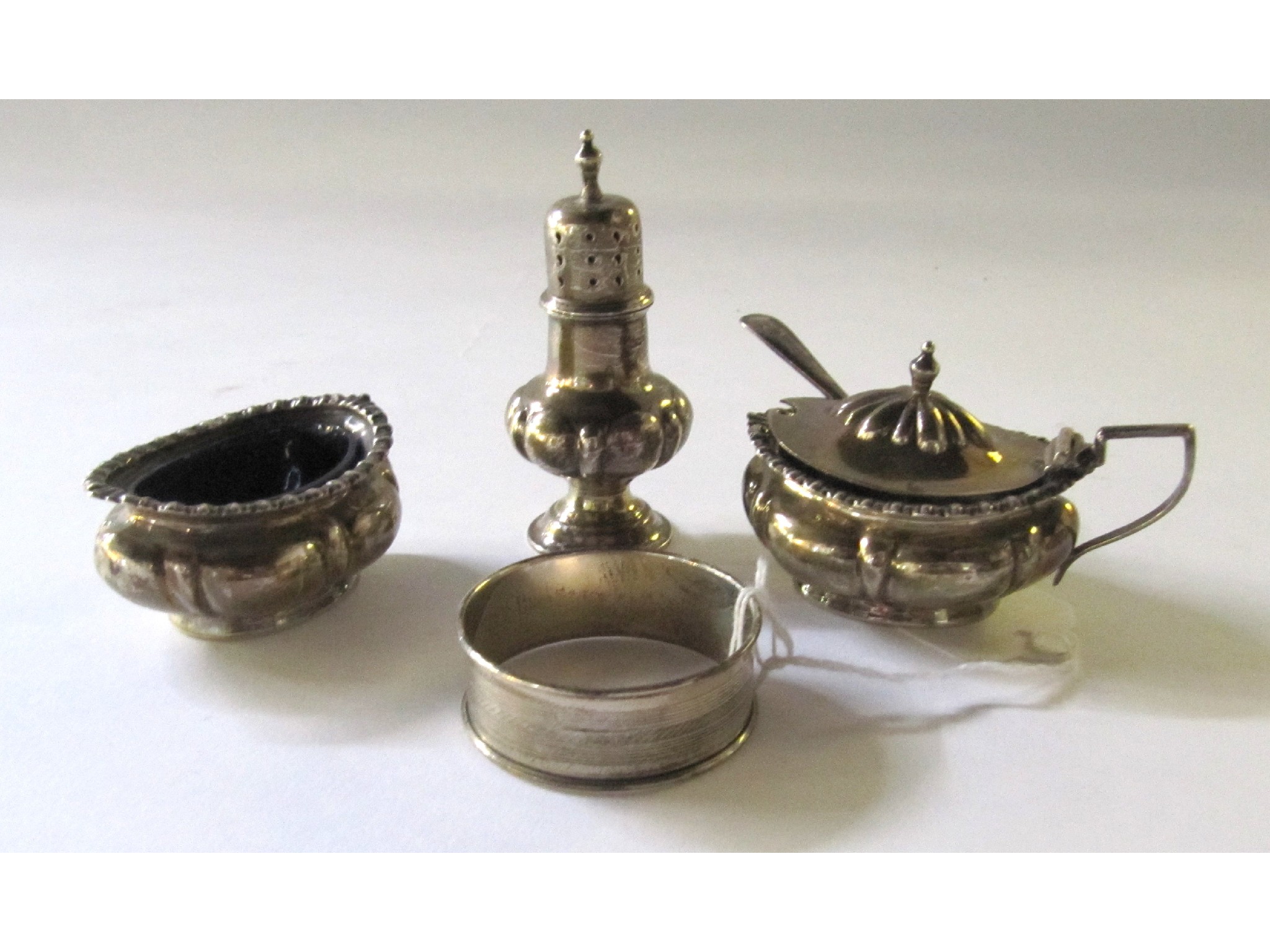 Appraisal: A lot comprising a three piece silver condiment set and