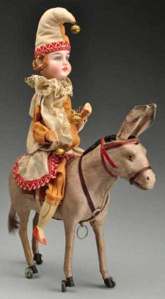 Appraisal: Bisque Head Clown on Donkey Pull Toy Description Bisque head