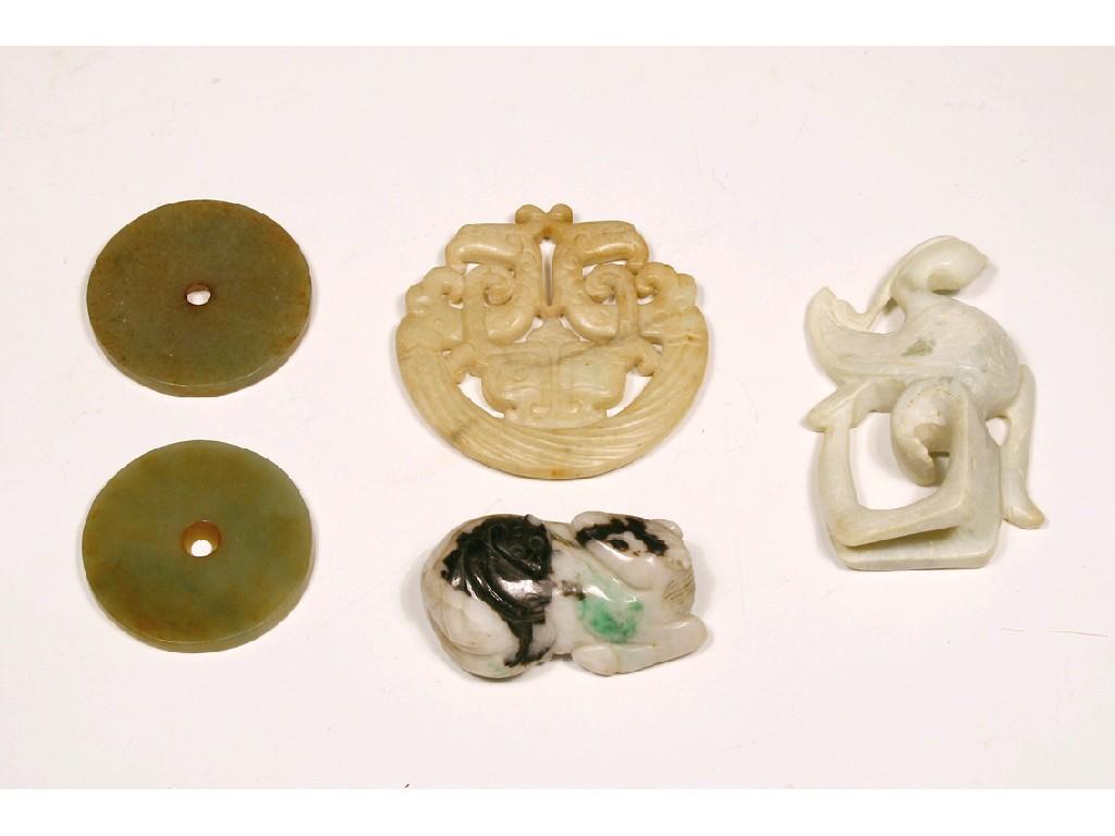 Appraisal: TWO CELADON JADE DISCS diameter an archaistic jadite crescent-shaped carving