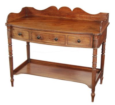 Appraisal: A Regency mahogany bowfront washstand in the manner of Gillows