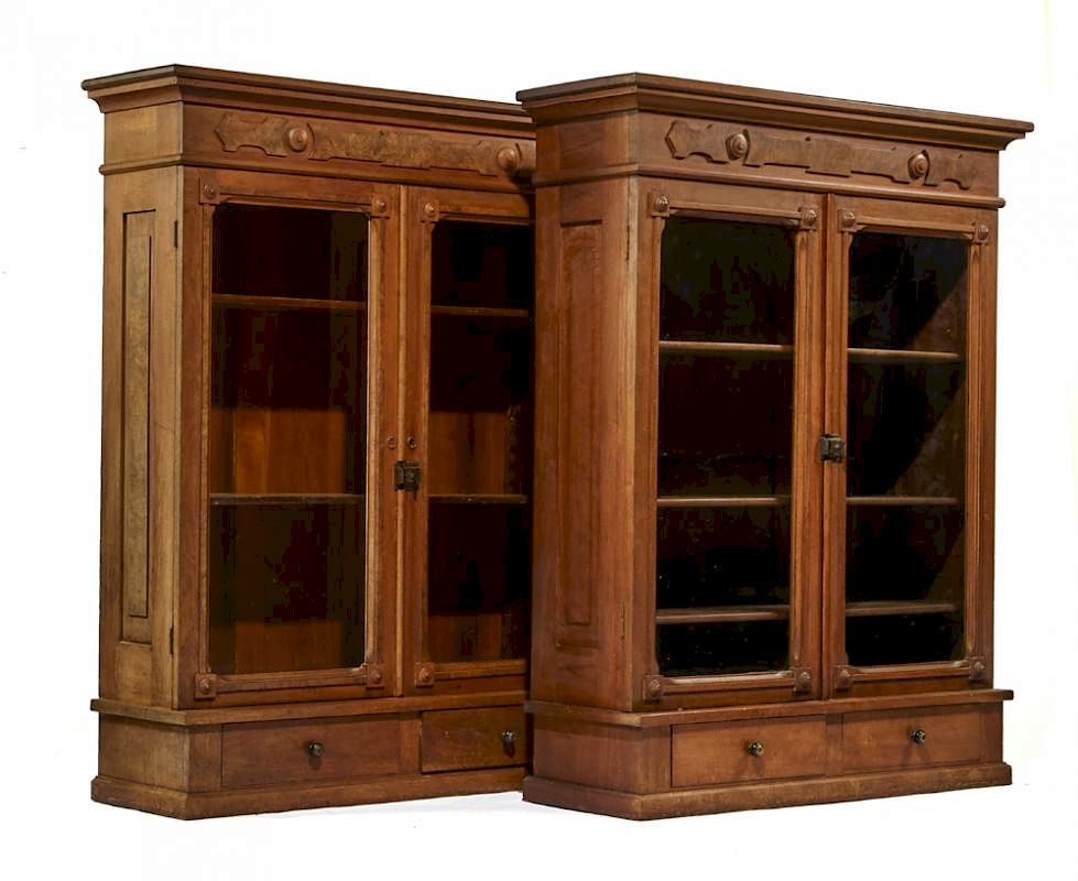 Appraisal: Pair American Victorian walnut bookcases Pair American Victorian walnut bookcases