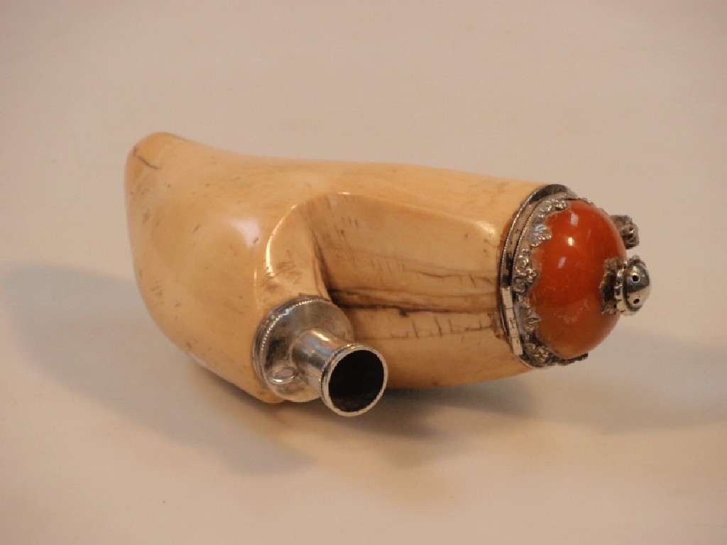 Appraisal: An antique whale tooth pipe with a silver mounted hinged