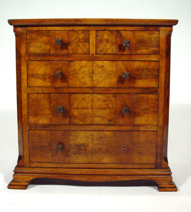 Appraisal: Cross-banded walnut miniature chest fitted two short above three long