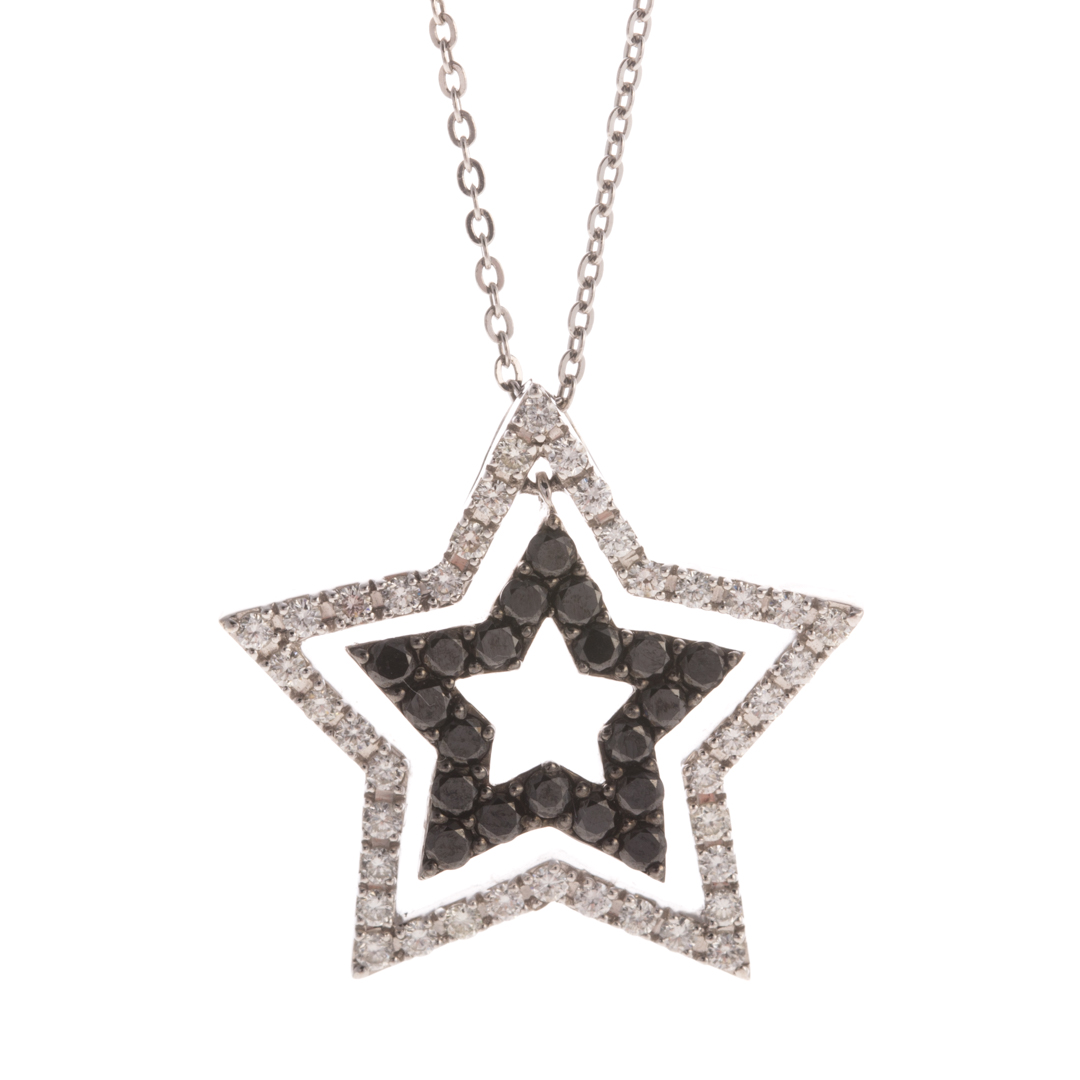 Appraisal: A Black White Diamond Star Pendant K white gold pendant