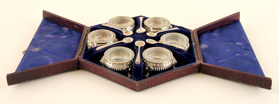 Appraisal: CASED SET ENGLISH SILVEPLATE SALTS SPOONS A cased set of