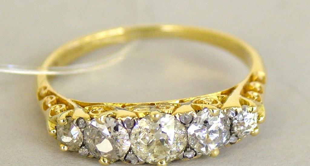 Appraisal: ct five stone diamond carved half hoop ring