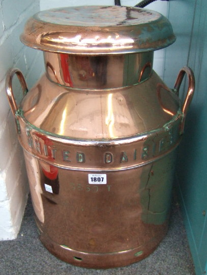 Appraisal: A 'United Dairies' coppered metal milk churn with two handles