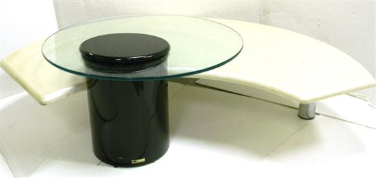 Appraisal: Rougier two-tier coffee table c circular glass top floats over