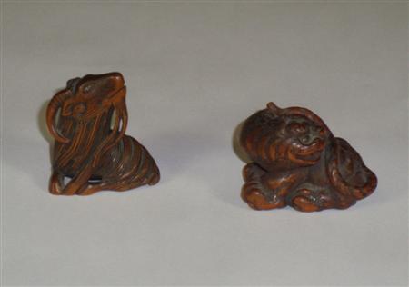 Appraisal: A Japanese carved wood okimono of a tiger character marks