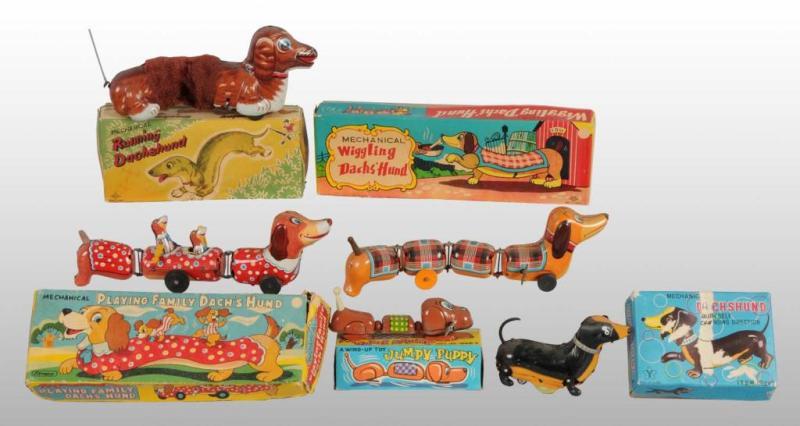 Appraisal: Lot of Tin Dachshund Dog Wind-Up Toys Description Japanese Working