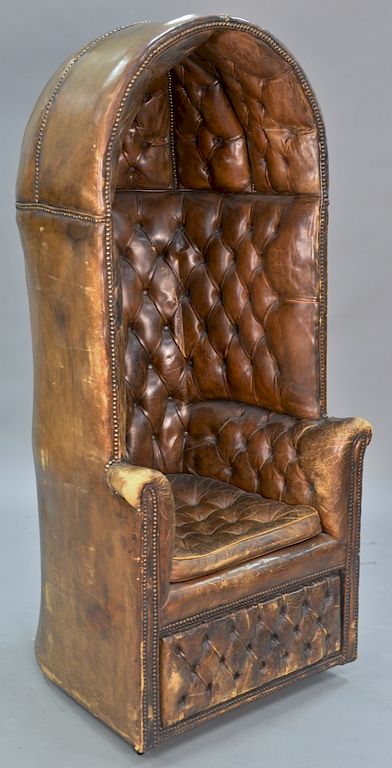 Appraisal: Leather tufted hooded chair with storage door in base ht