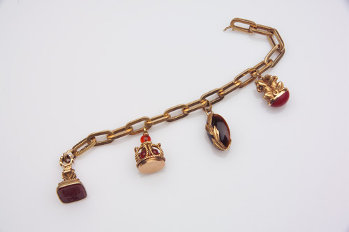 Appraisal: TH C Charm bracelet in k yellow gold of solid