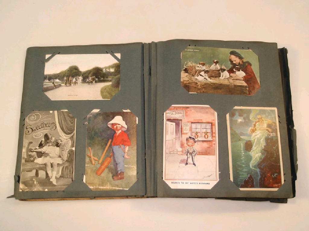 Appraisal: An early thC postcard album containing approximately cards including humerous