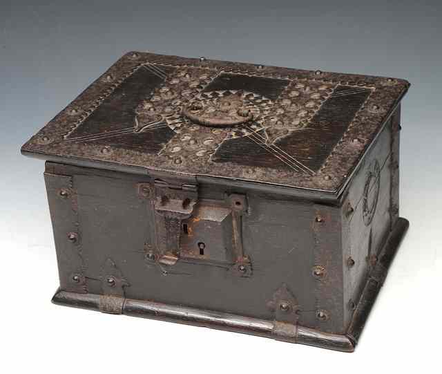 Appraisal: AN OLD CARVED WOODEN CASKET with iron mounts ring handle