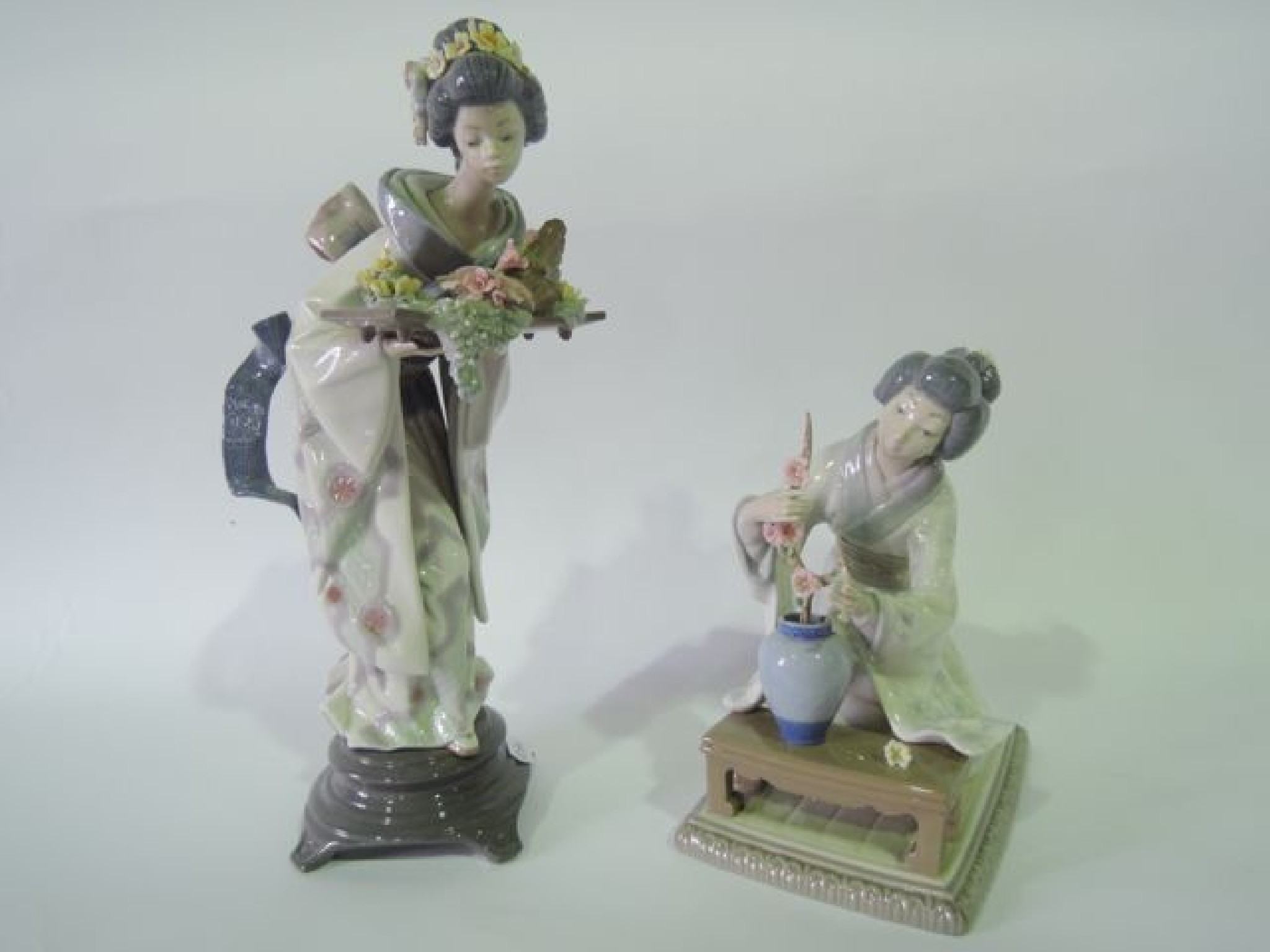 Appraisal: Two Lladro Daisa figures of female characters in Japanese costume