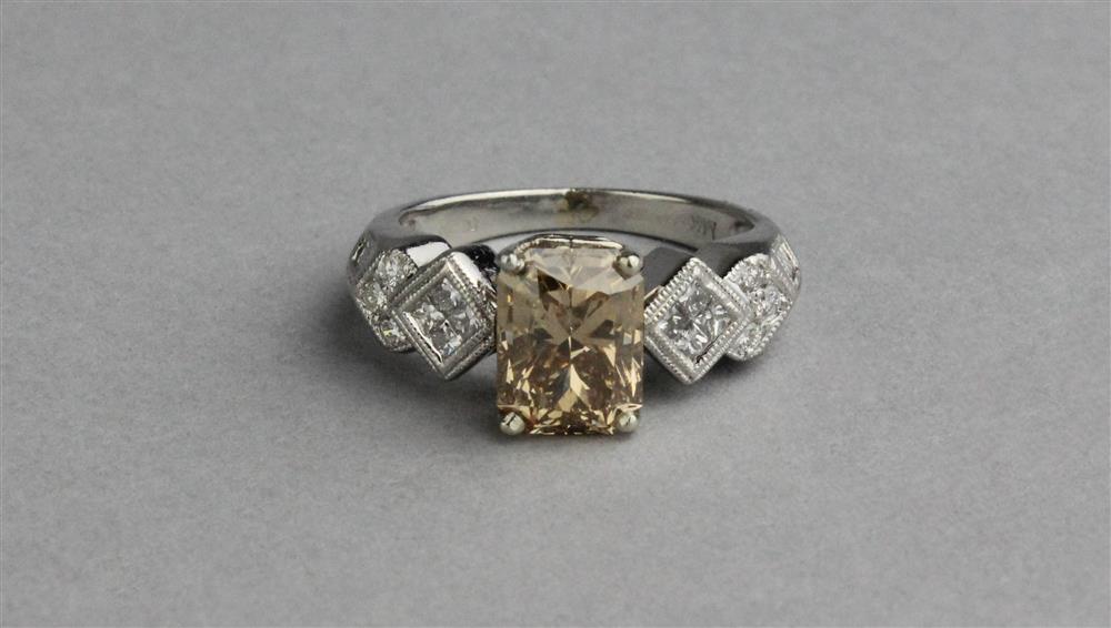 Appraisal: PLATINUM FANCY YELLOW DIAMOND AND DIAMOND RING platinum ring set