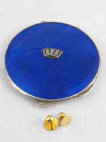 Appraisal: A silver and blue enamel compact decorated with a silver