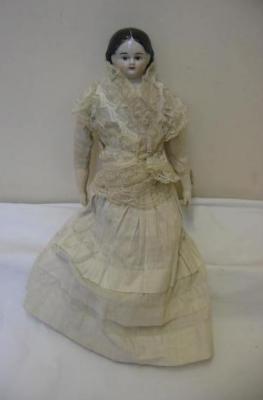 Appraisal: A china shoulder head doll with moulded and painted wig