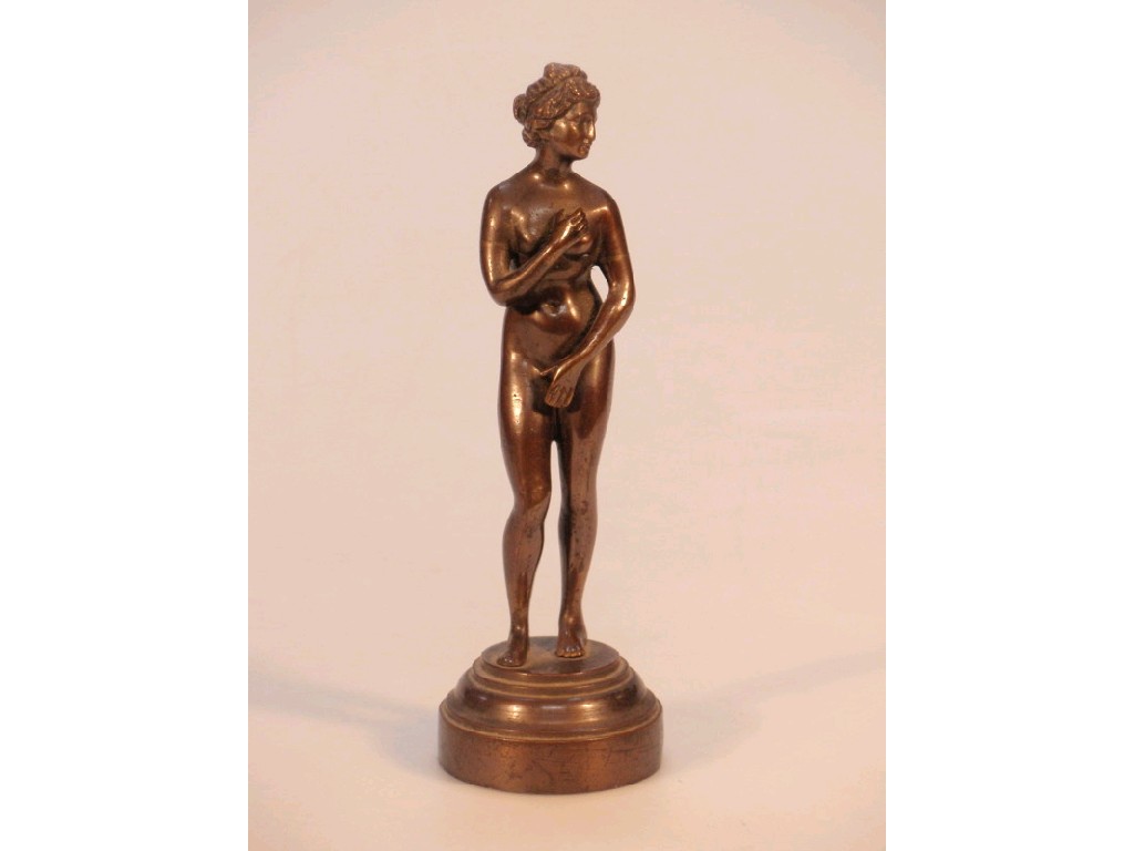 Appraisal: A thC bronze miniature statue of a naked female on