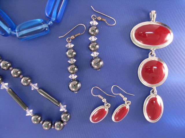 Appraisal: A silver red enamel pendant with a matching pair of