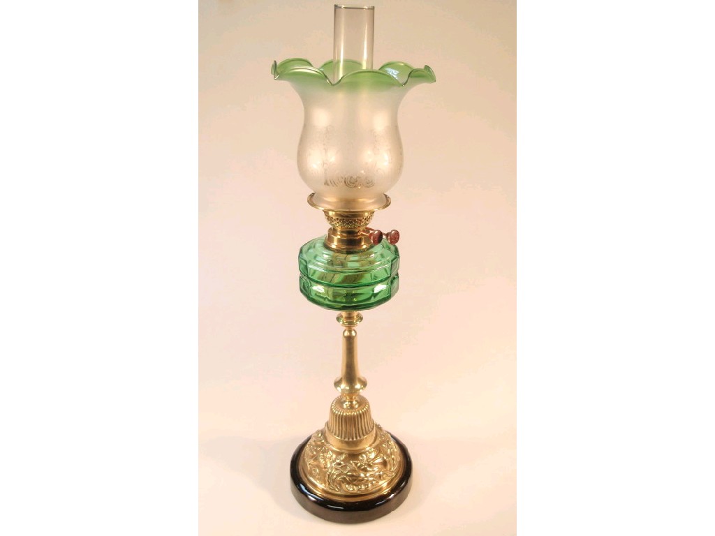 Appraisal: A thC oil lamp with a clear emerald green glass