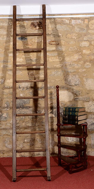 Appraisal: AN OLD WOODEN LIBRARY LADDER ten rung with plain supports