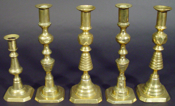 Appraisal: Two pairs of brass octagonal based candlesticks and one other